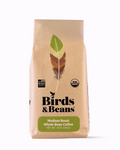 Birds & Beans coffee bag with a leaf and feather design on a white background